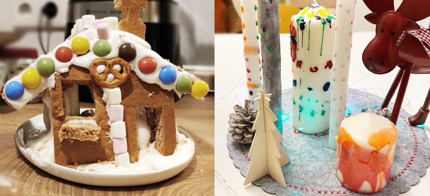 ein Lebkuchenhaus und weihnachtliche Kerzen und Dekoration
